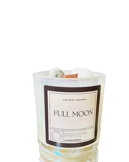 Candle labeled 'Full Moon' by The Wick Goddess on a white background