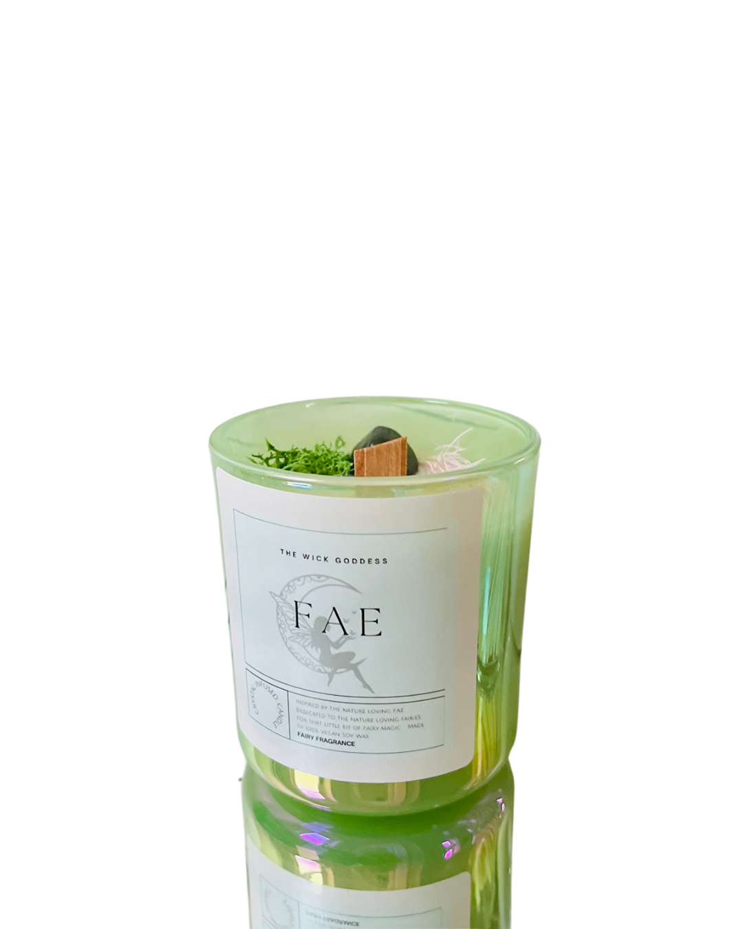 Green candle with a label on a white background