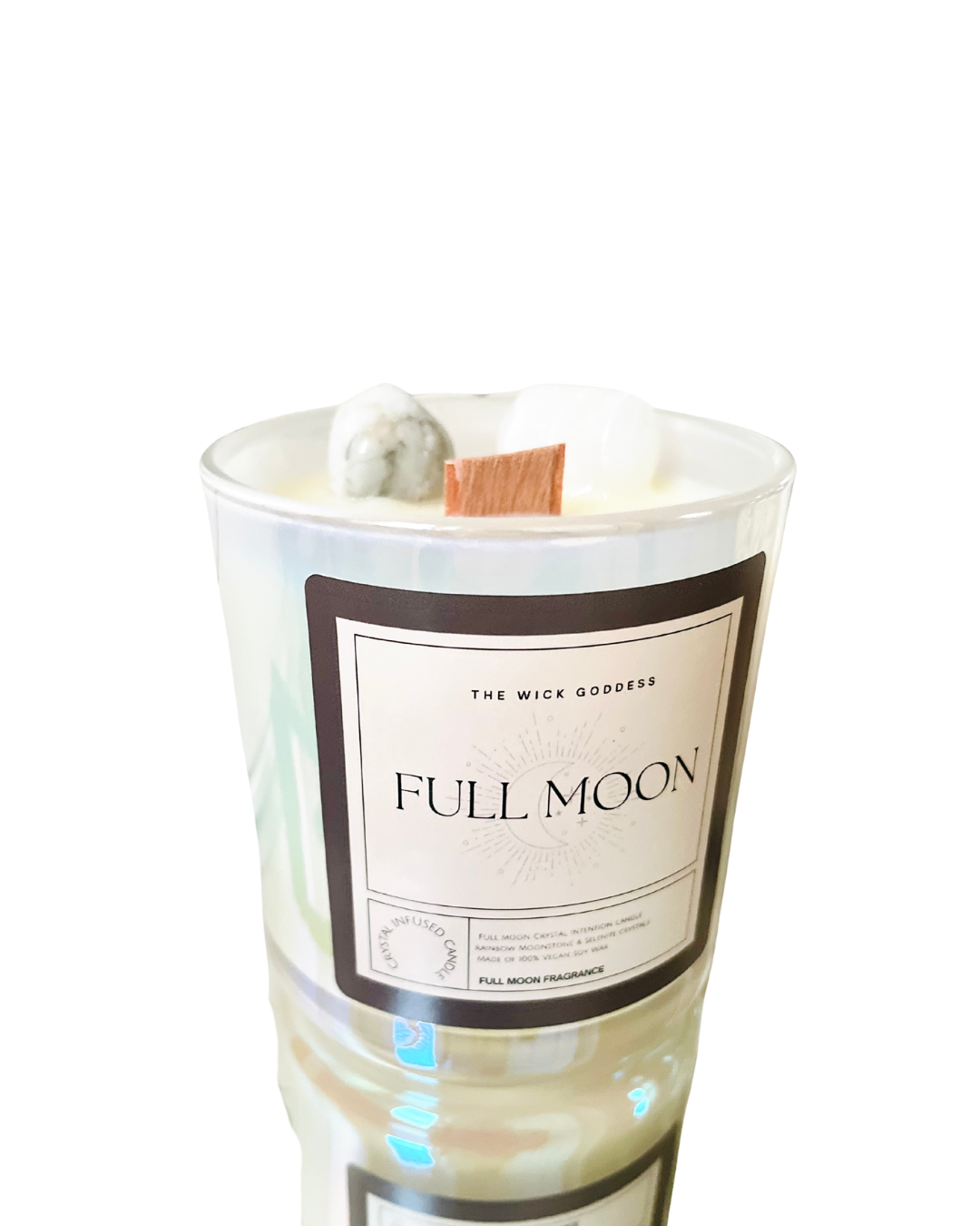 Candle labeled 'Full Moon' by The Wick Goddess on a white background