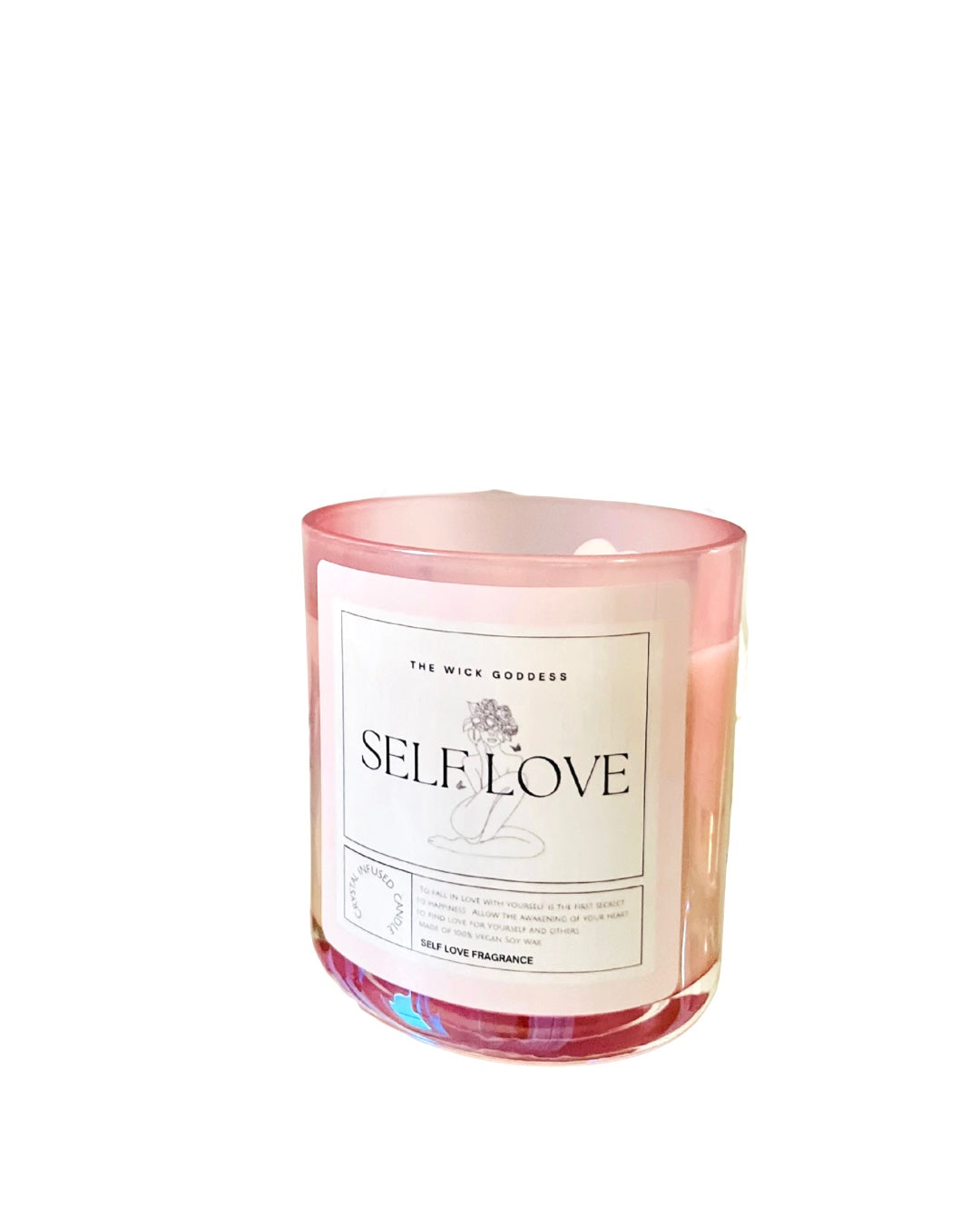 Candle with 'Self Love' label on a white background