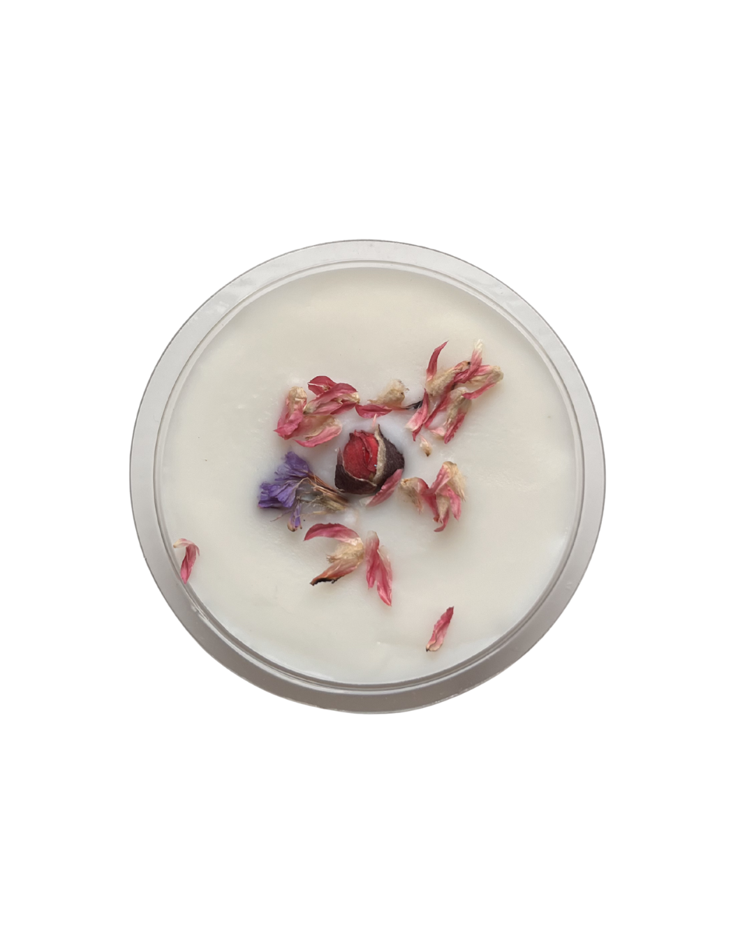 Wax melt with dried flowers in a glass container on a white background