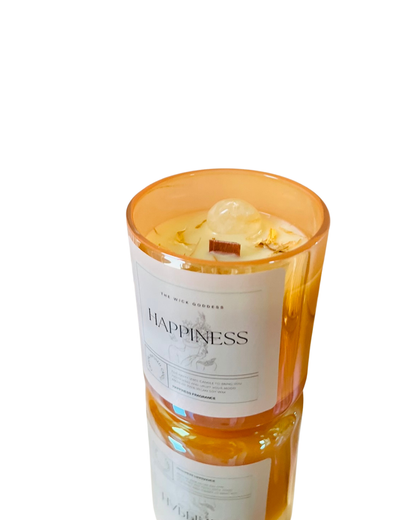 Candle labeled 'Happiness' with a white label on a white background