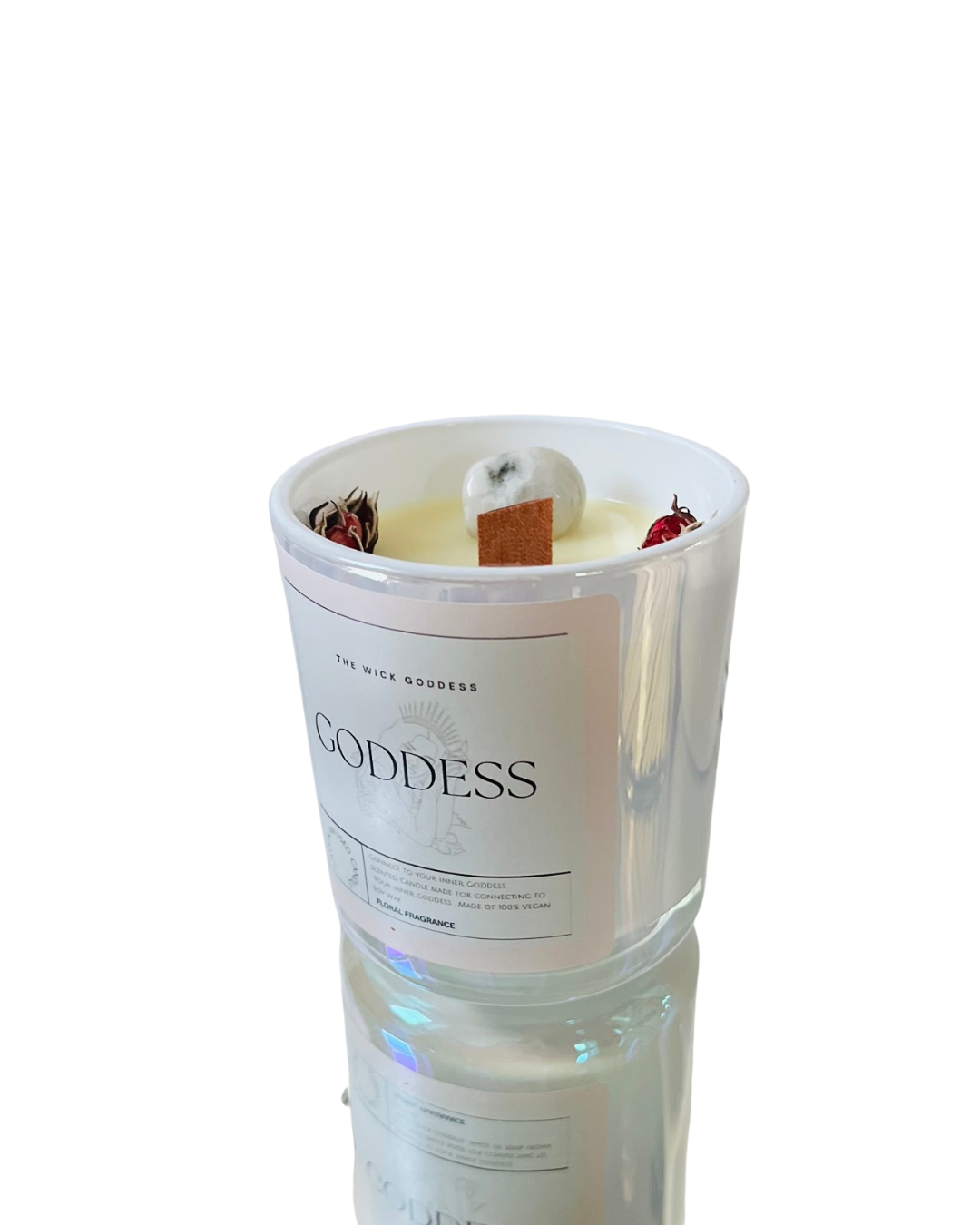 Candle in a glass container labeled 'Goddess' on a white background