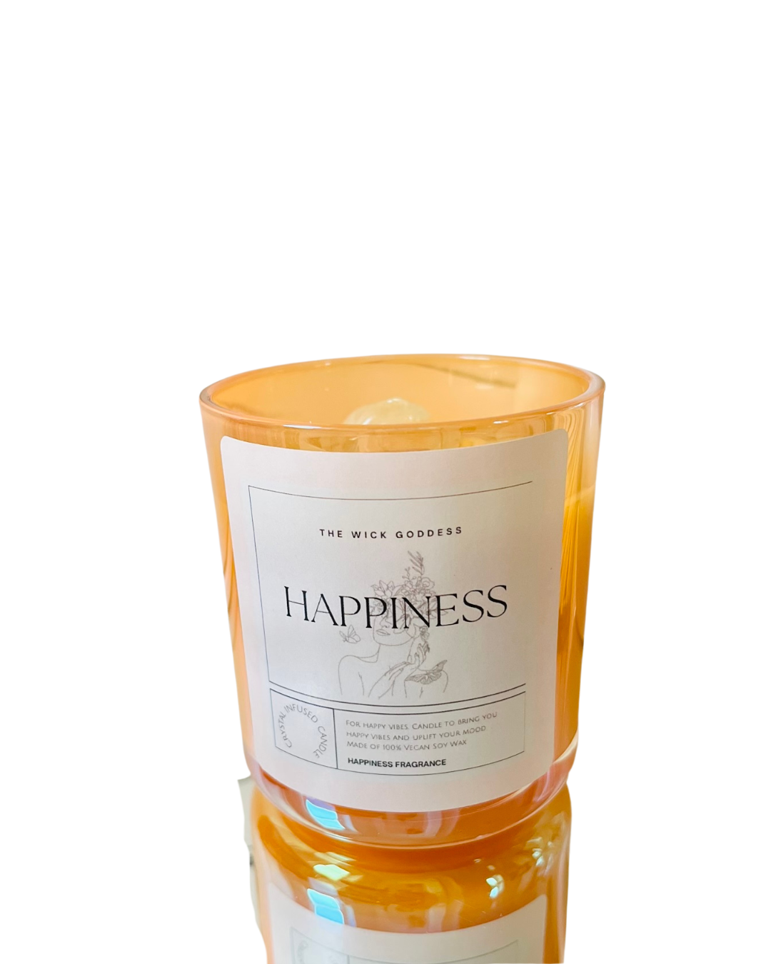 Candle with an orange holder and white label on a white background