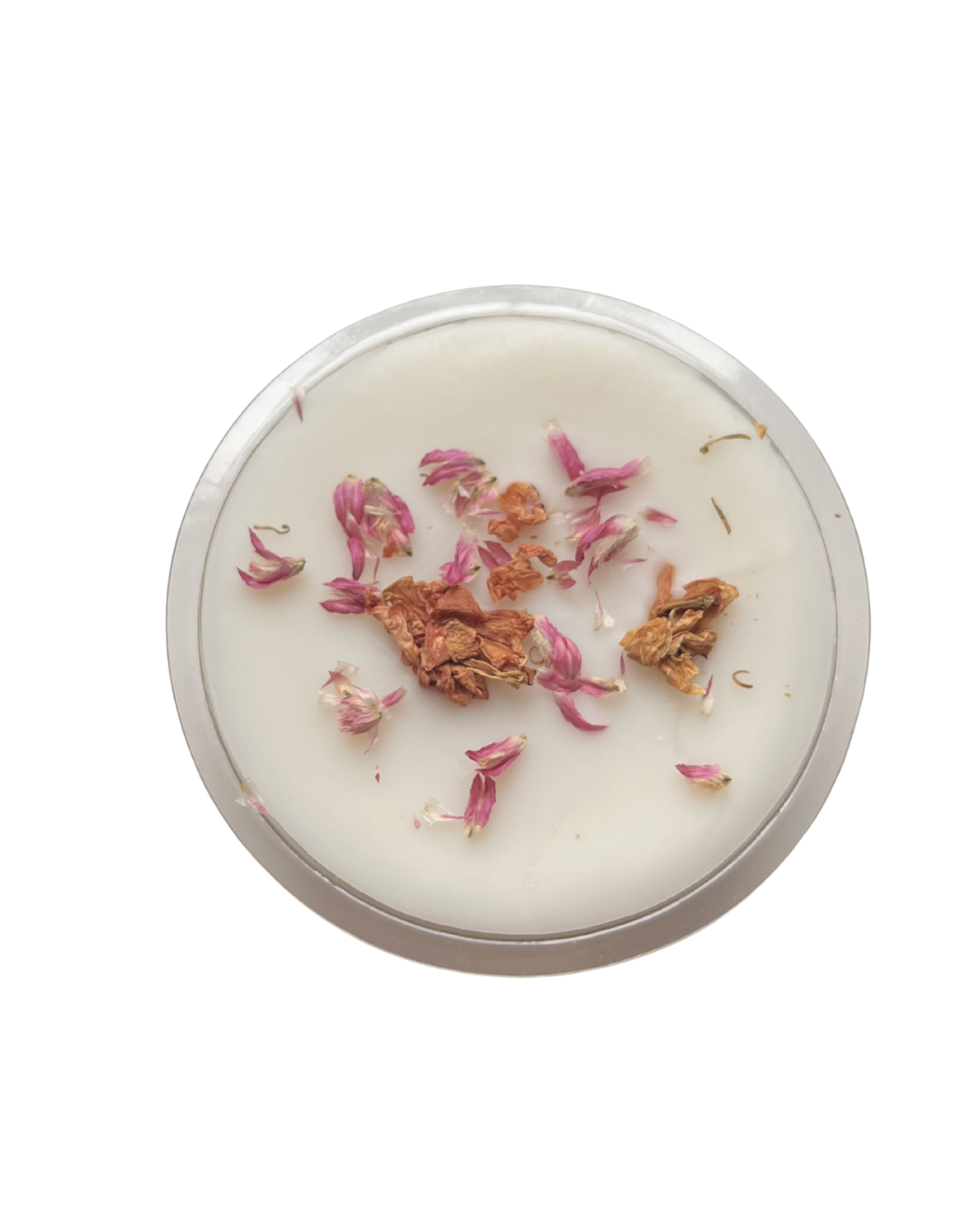 Candle with dried flowers and herbs on a white background